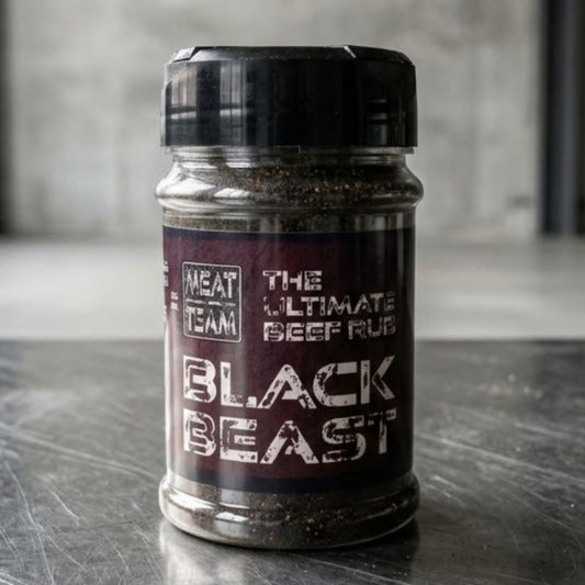 Black beast ultimate beef rub for beef, brisket, short ribs, standing on steel surface in industrial unit space
